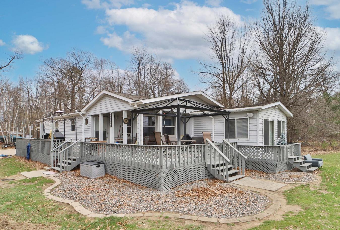 Set on a sprawling 3-acre lot along the shores of Perch Lake in Merrif – image 1