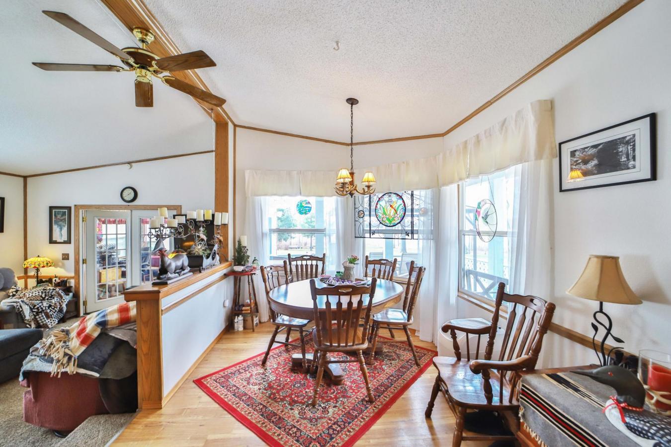 Set on a sprawling 3-acre lot along the shores of Perch Lake in Merrif – image 11