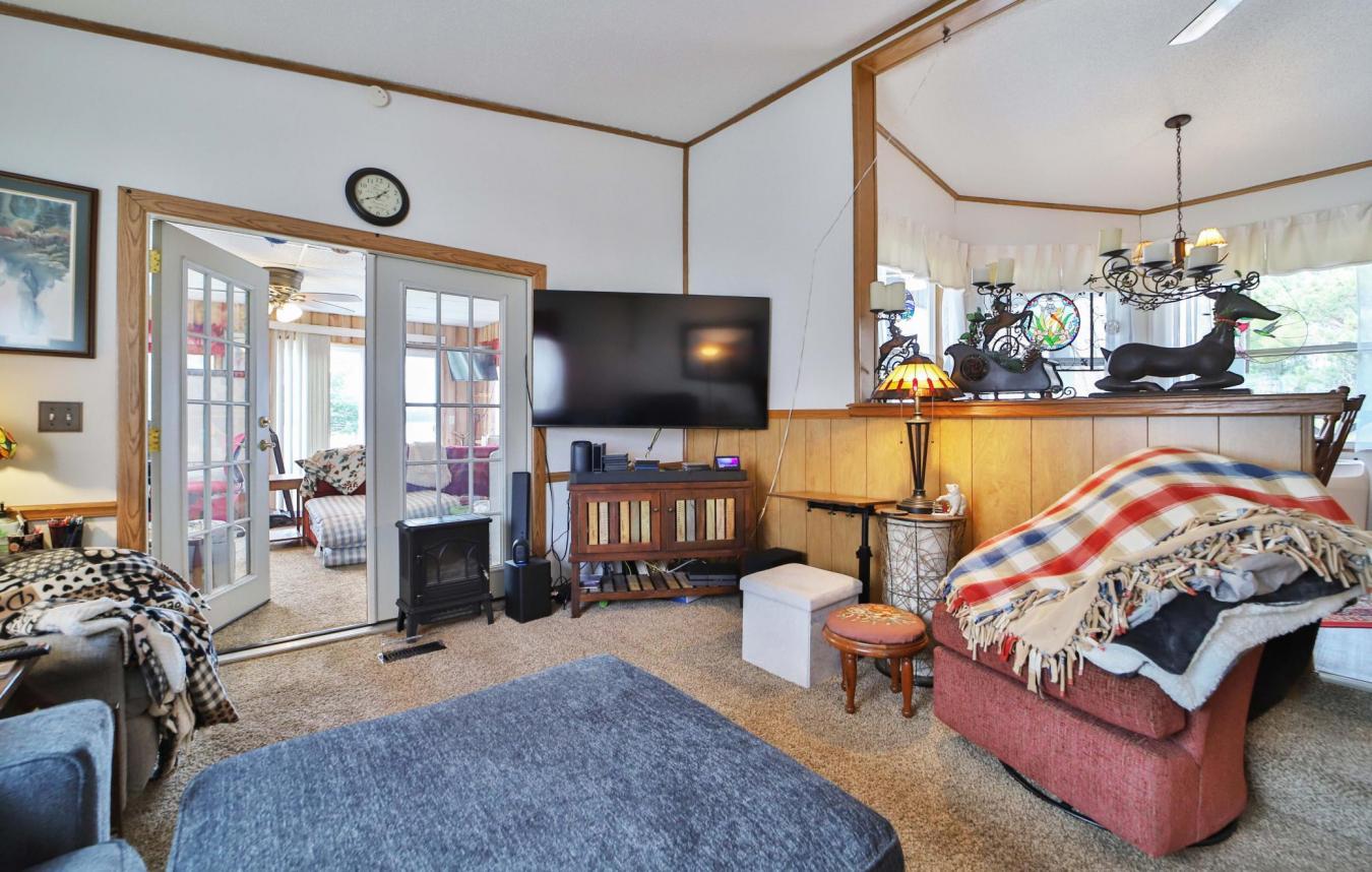 Set on a sprawling 3-acre lot along the shores of Perch Lake in Merrif – image 14