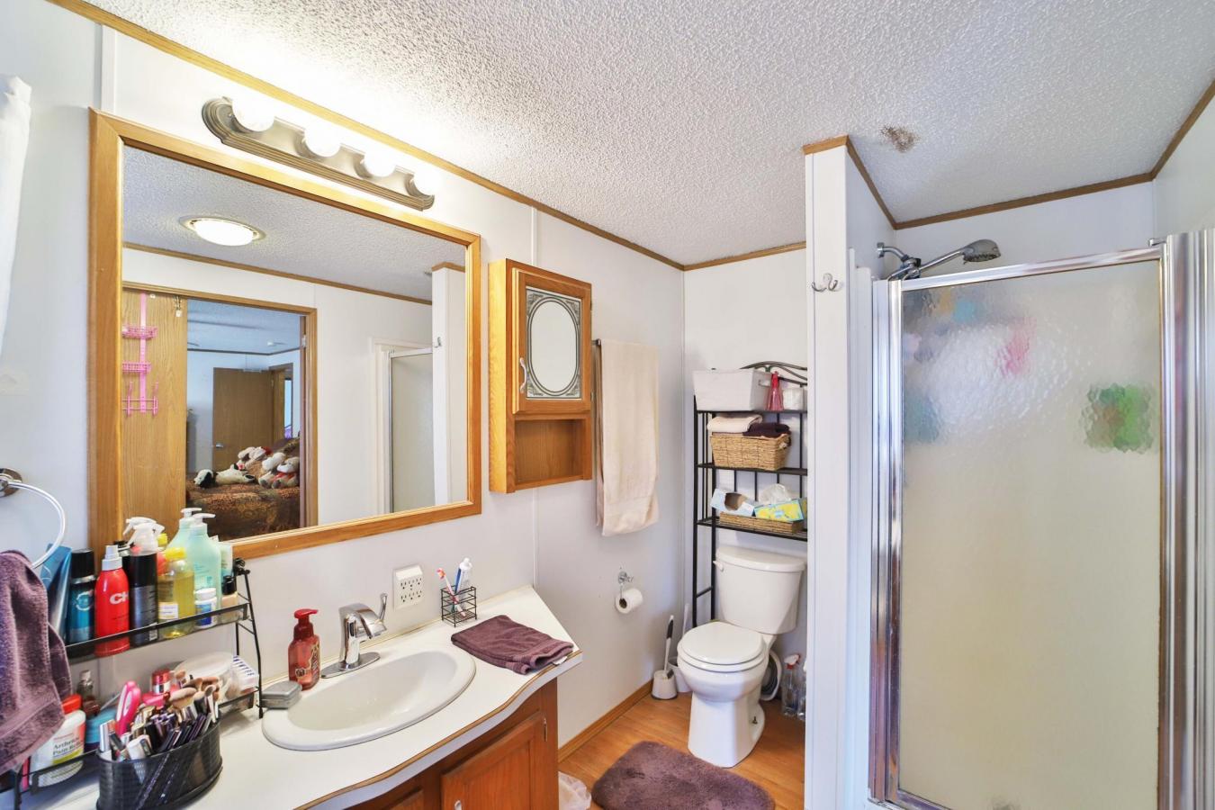 Set on a sprawling 3-acre lot along the shores of Perch Lake in Merrif – image 16