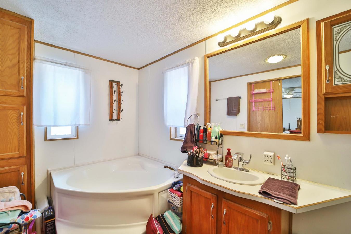 Set on a sprawling 3-acre lot along the shores of Perch Lake in Merrif – image 17