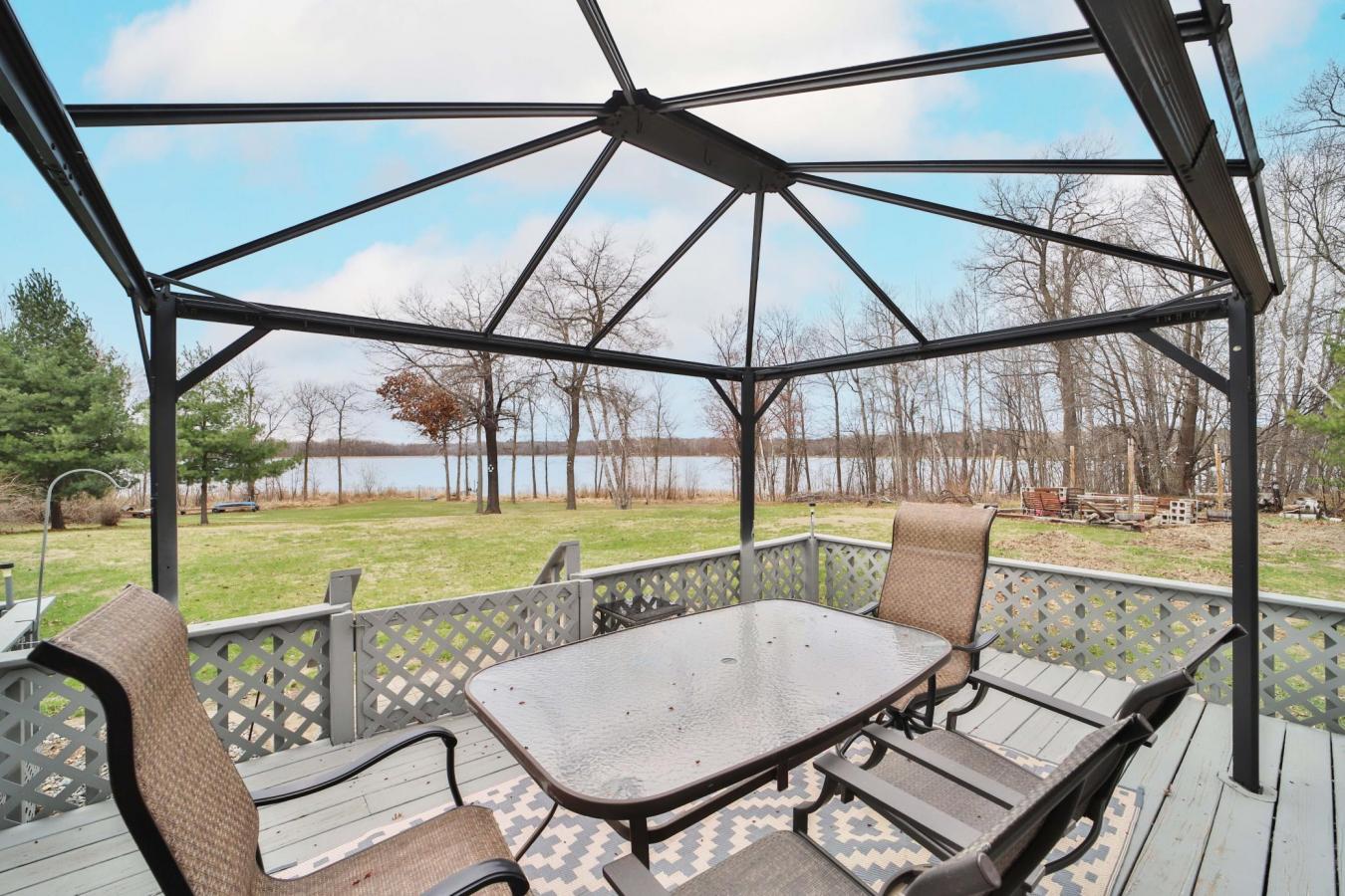 Set on a sprawling 3-acre lot along the shores of Perch Lake in Merrif – image 3