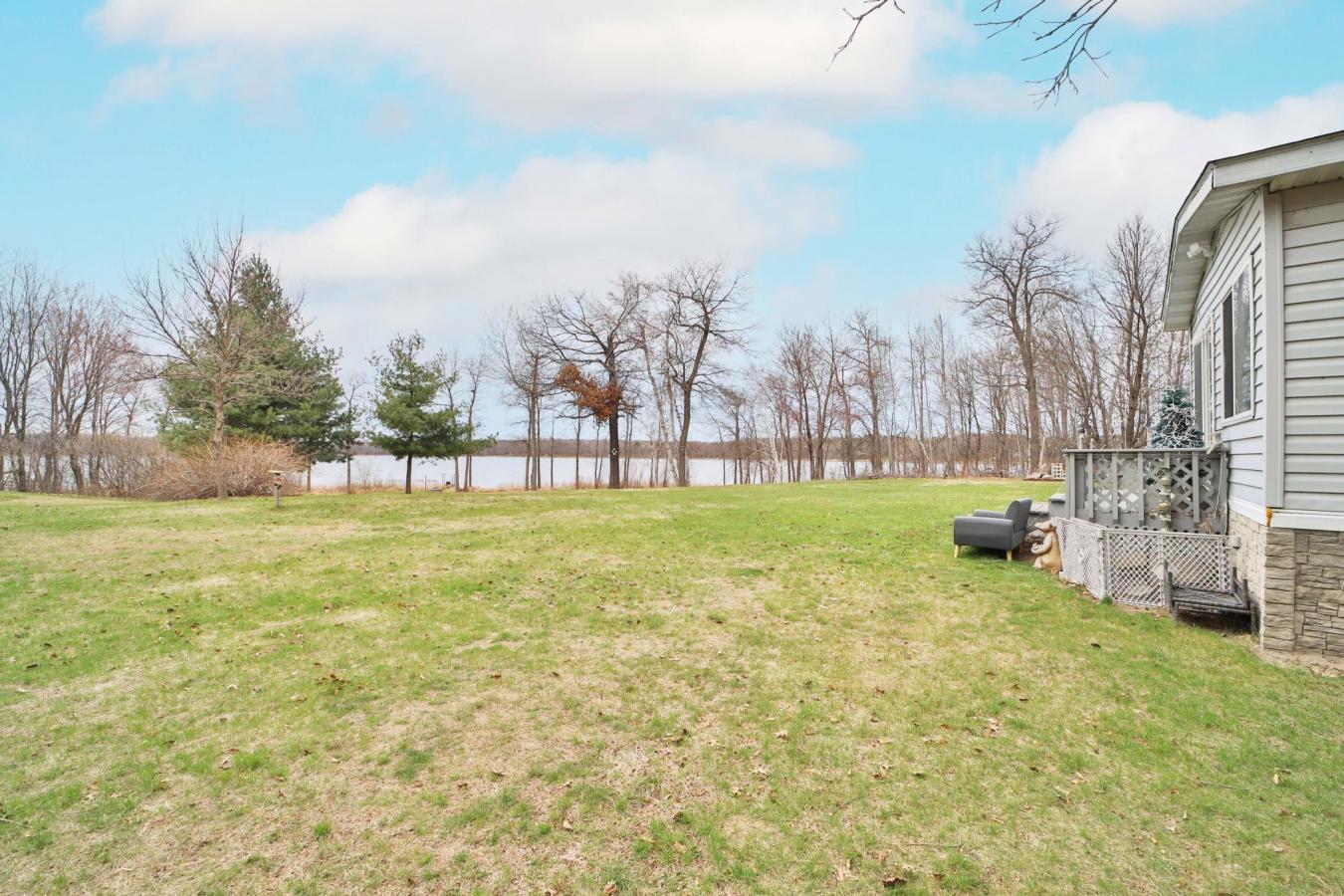 Set on a sprawling 3-acre lot along the shores of Perch Lake in Merrif – image 4