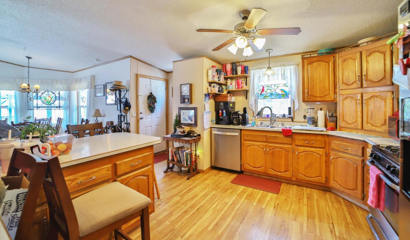 Set on a sprawling 3-acre lot along the shores of Perch Lake in Merrif – image 6