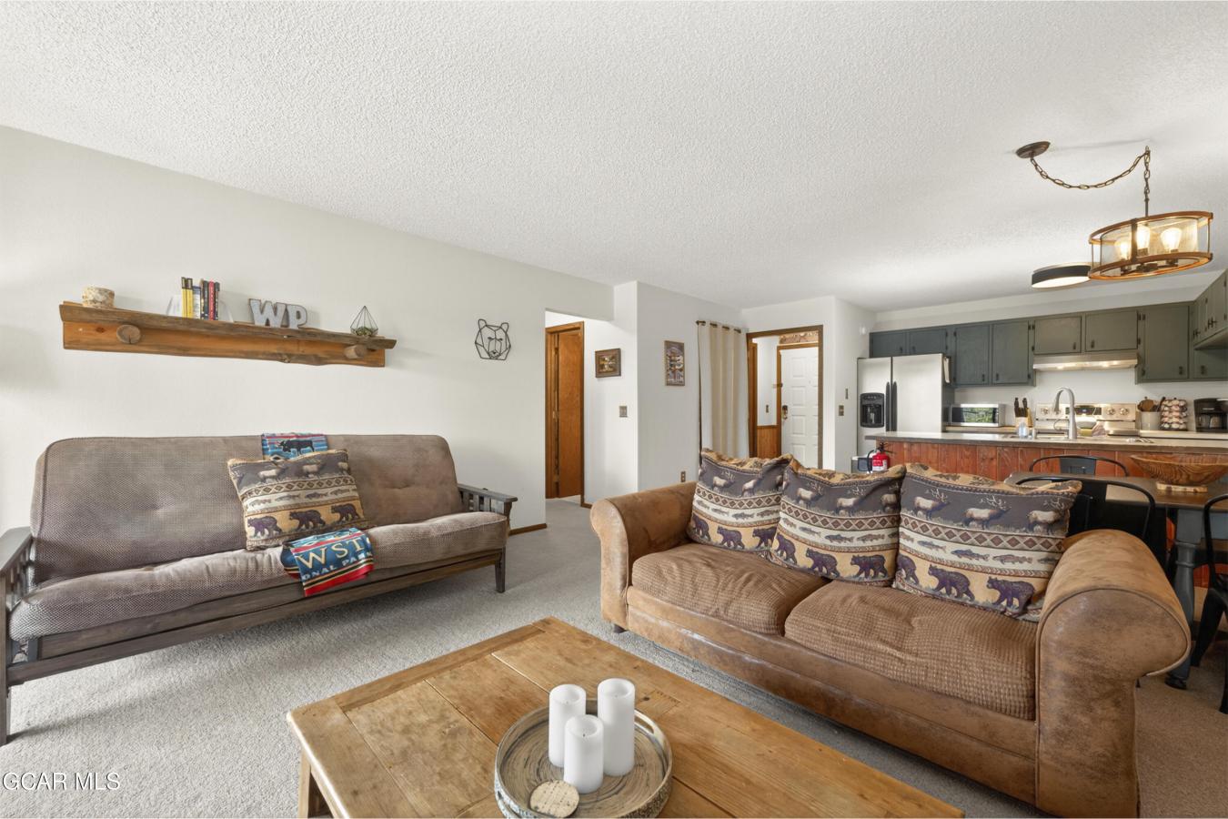 This inviting mountain retreat makes for a perfect full-time home, wee – image 1