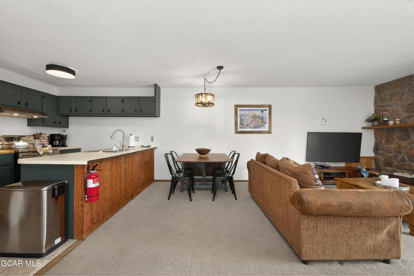 This inviting mountain retreat makes for a perfect full-time home, wee – image 10