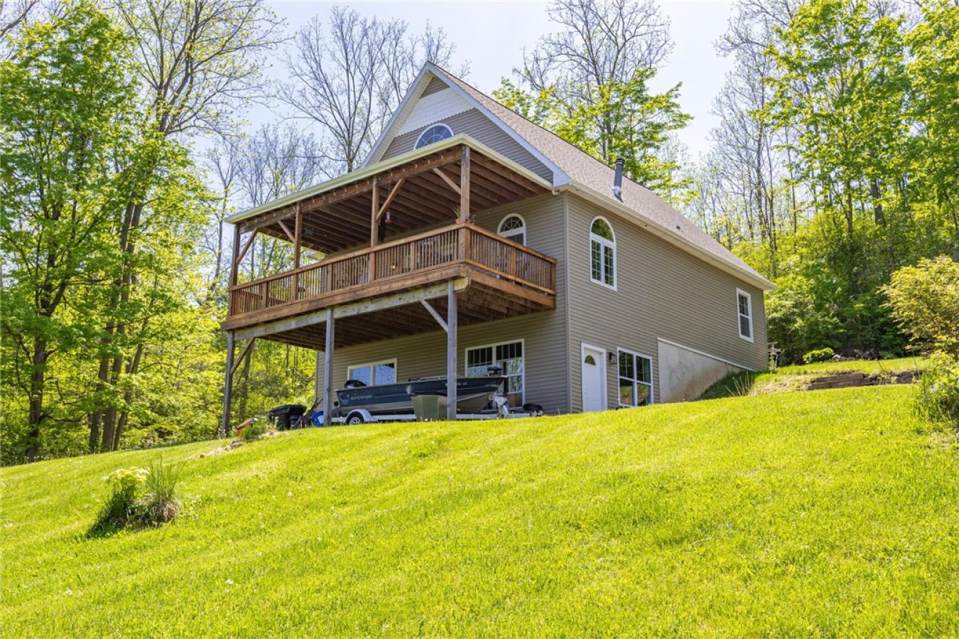 Perched high above the treetops on nearly 5 breathtaking acres, this e – image 1