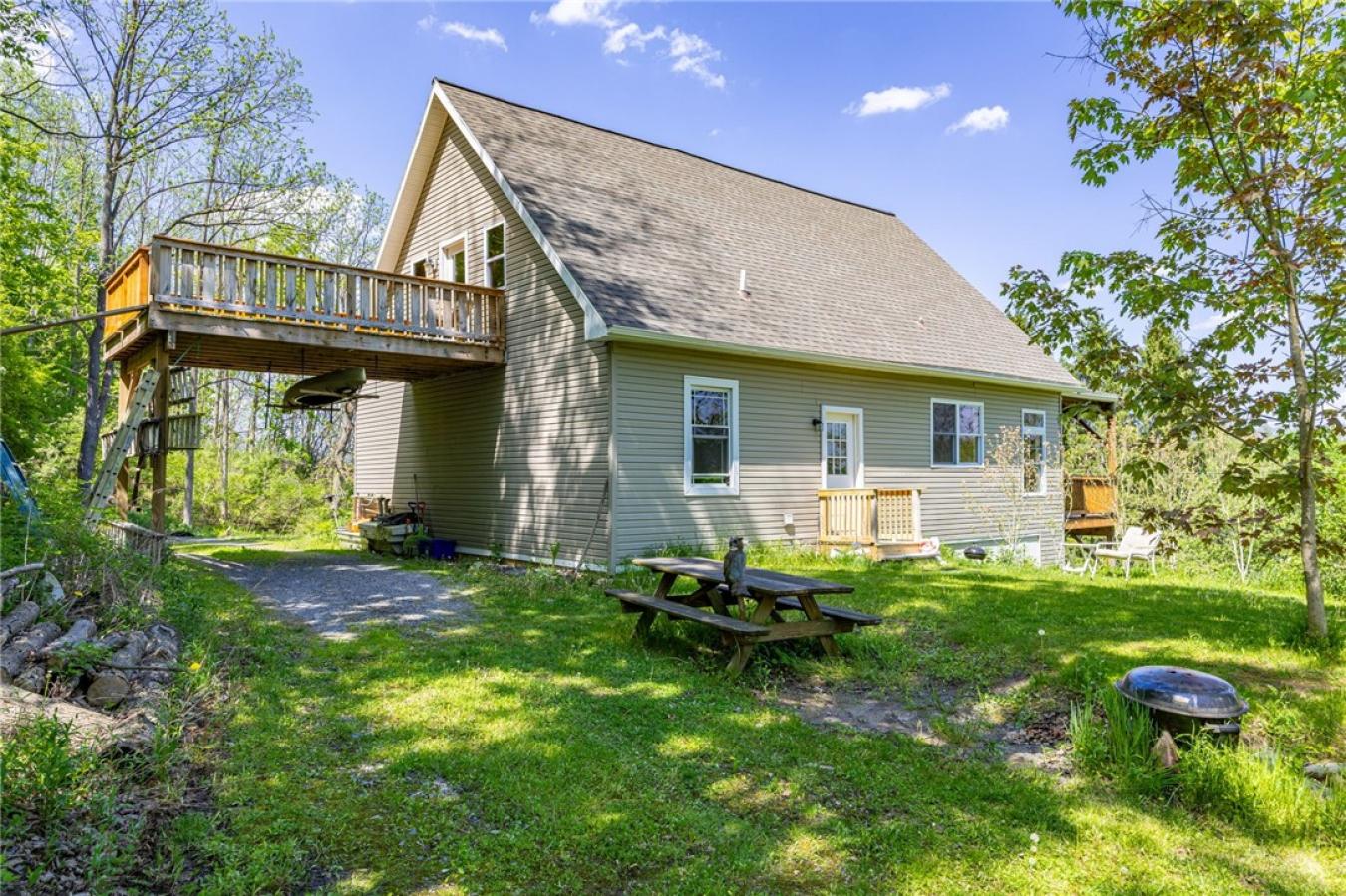 Perched high above the treetops on nearly 5 breathtaking acres, this e – image 10