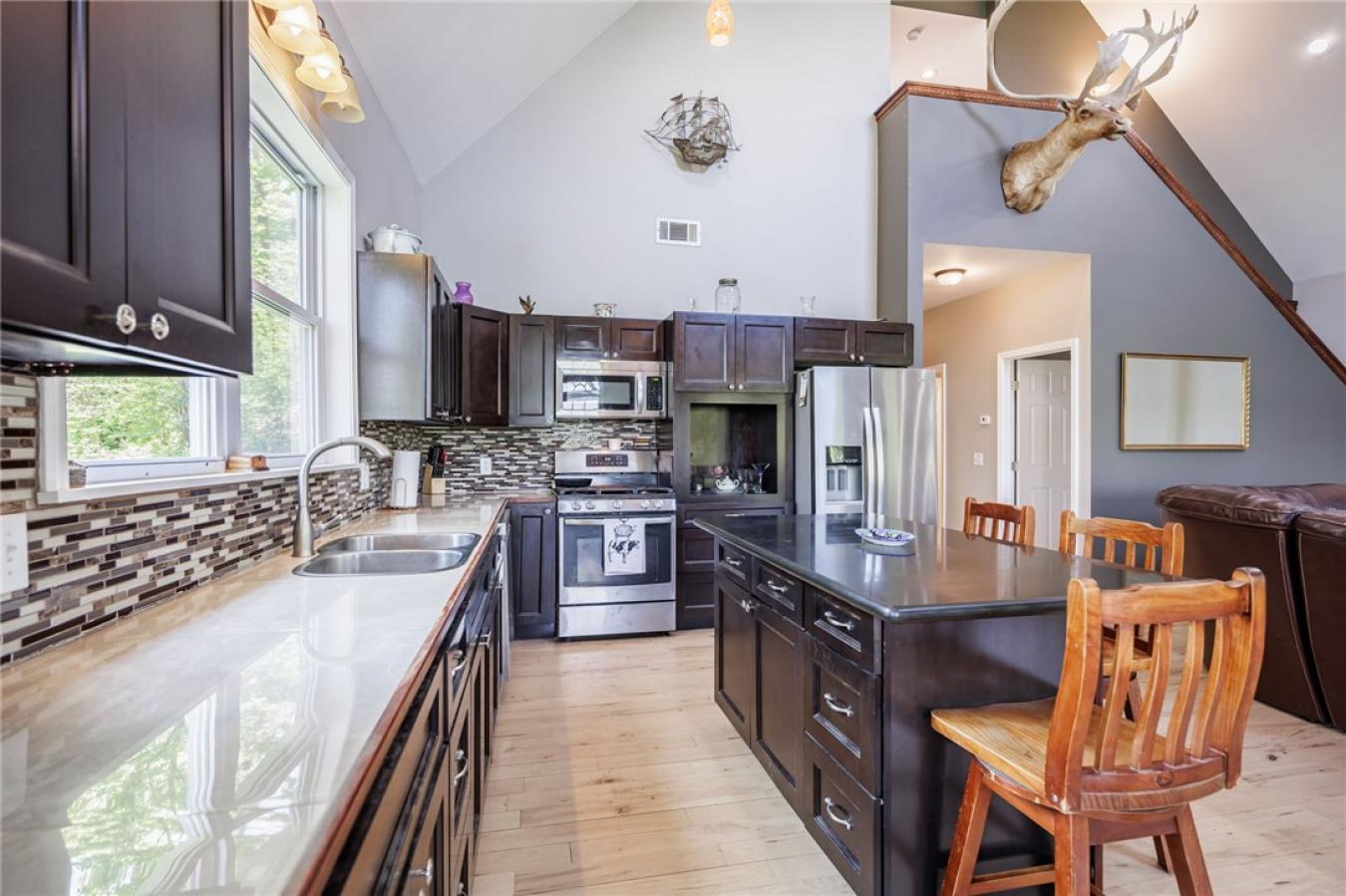 Perched high above the treetops on nearly 5 breathtaking acres, this e – image 12