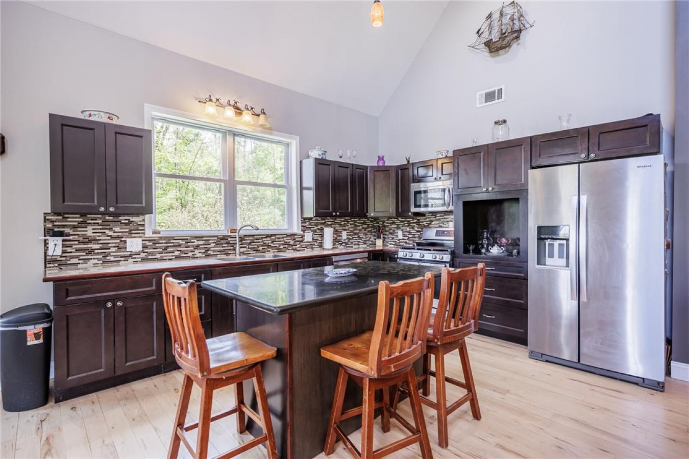 Perched high above the treetops on nearly 5 breathtaking acres, this e – image 18