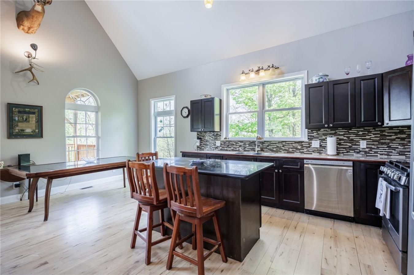Perched high above the treetops on nearly 5 breathtaking acres, this e – image 19