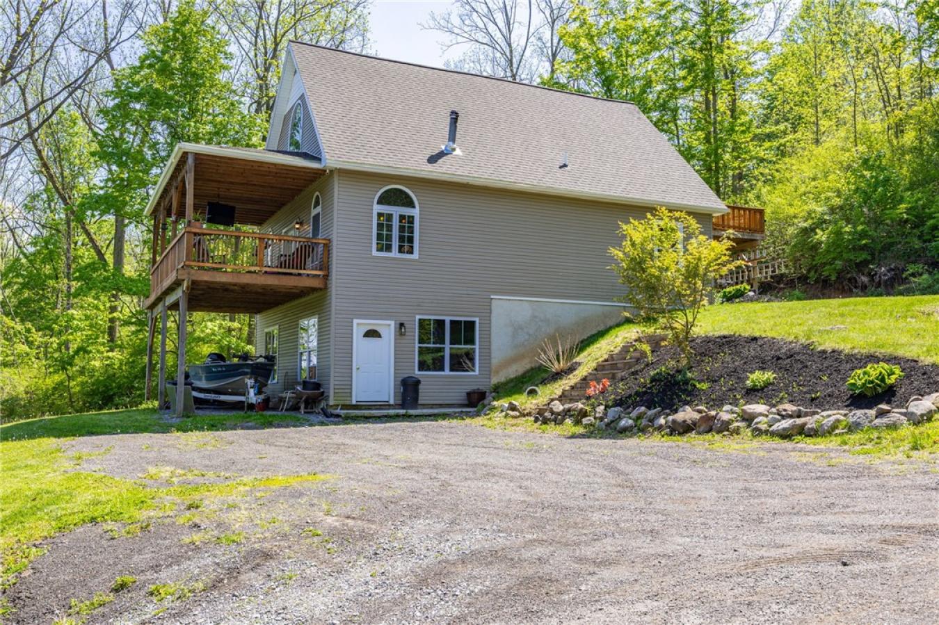 Perched high above the treetops on nearly 5 breathtaking acres, this e – image 2