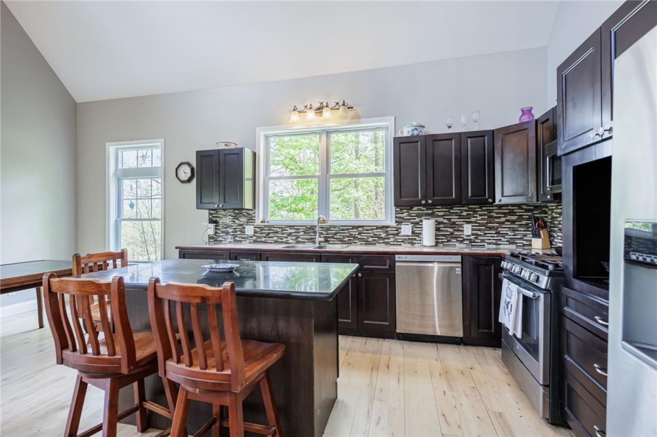 Perched high above the treetops on nearly 5 breathtaking acres, this e – image 20