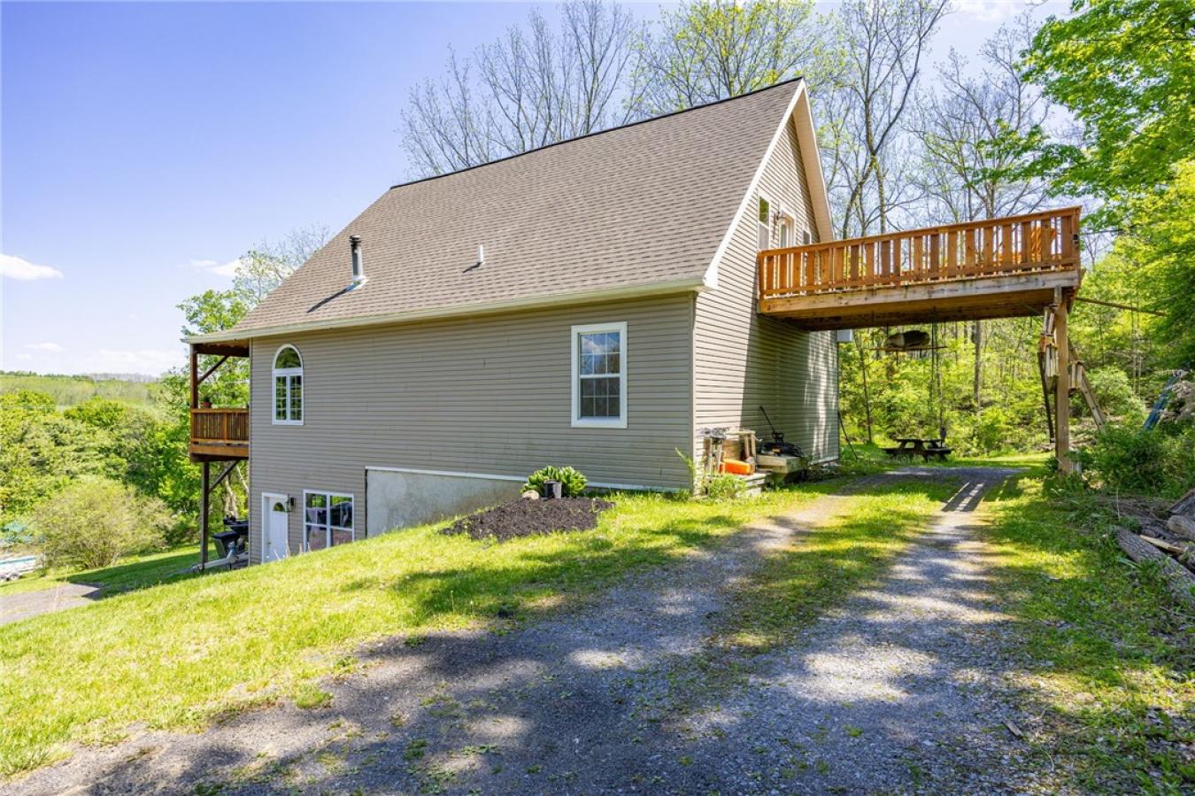 Perched high above the treetops on nearly 5 breathtaking acres, this e – image 3