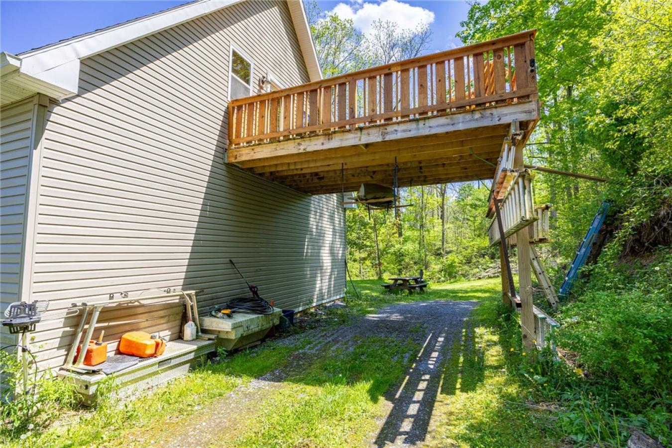 Perched high above the treetops on nearly 5 breathtaking acres, this e – image 4
