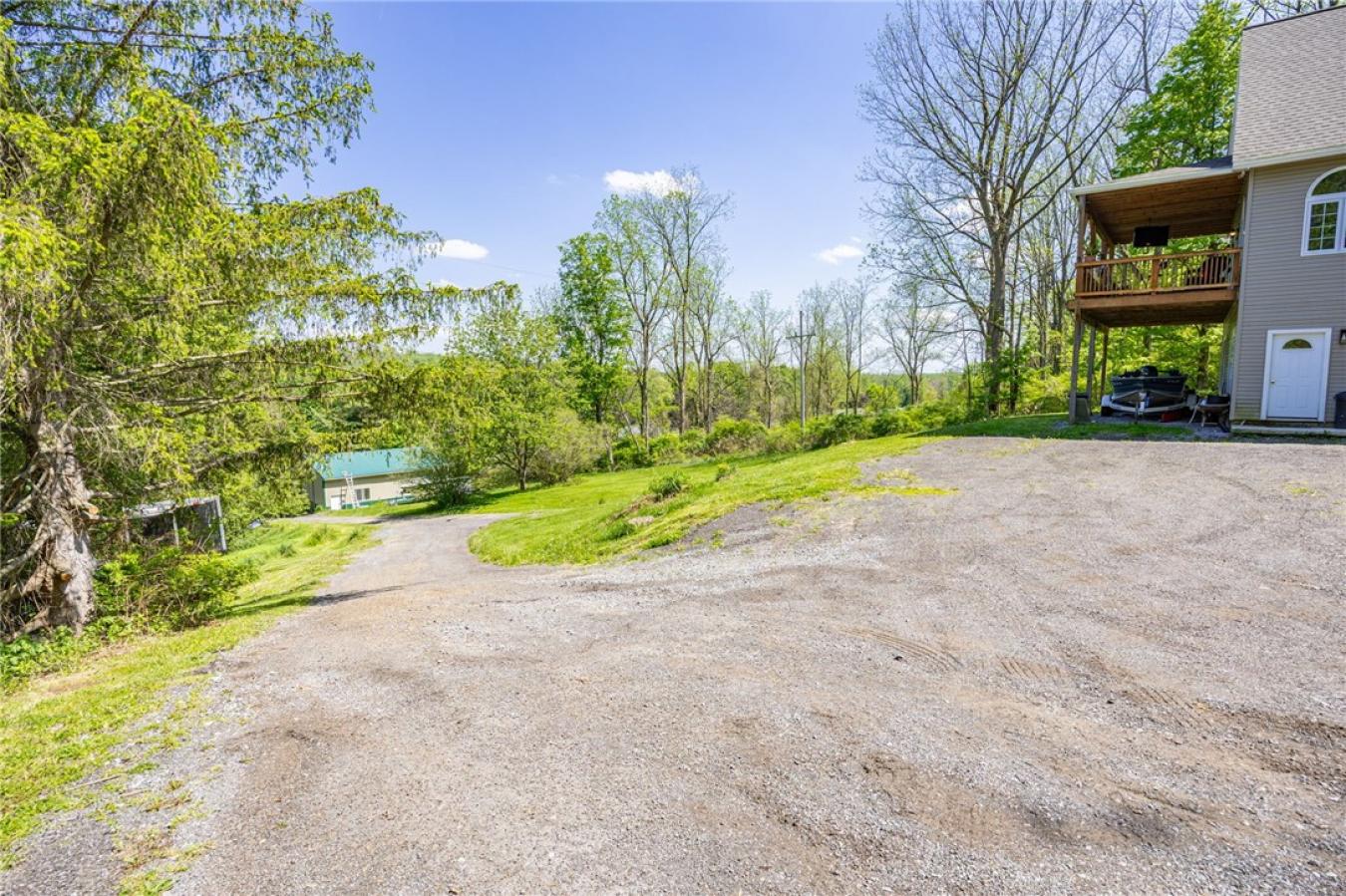 Perched high above the treetops on nearly 5 breathtaking acres, this e – image 6