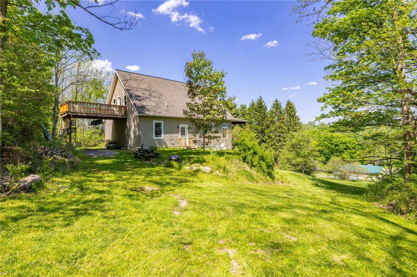 Perched high above the treetops on nearly 5 breathtaking acres, this e – image 9