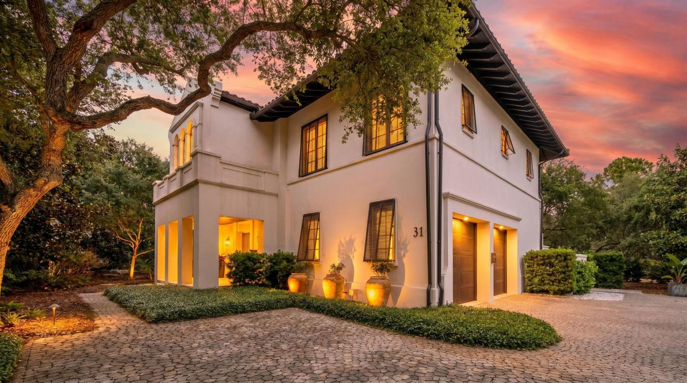 Tucked beneath a canopy of majestic Southern live oaks, this exception – image 1