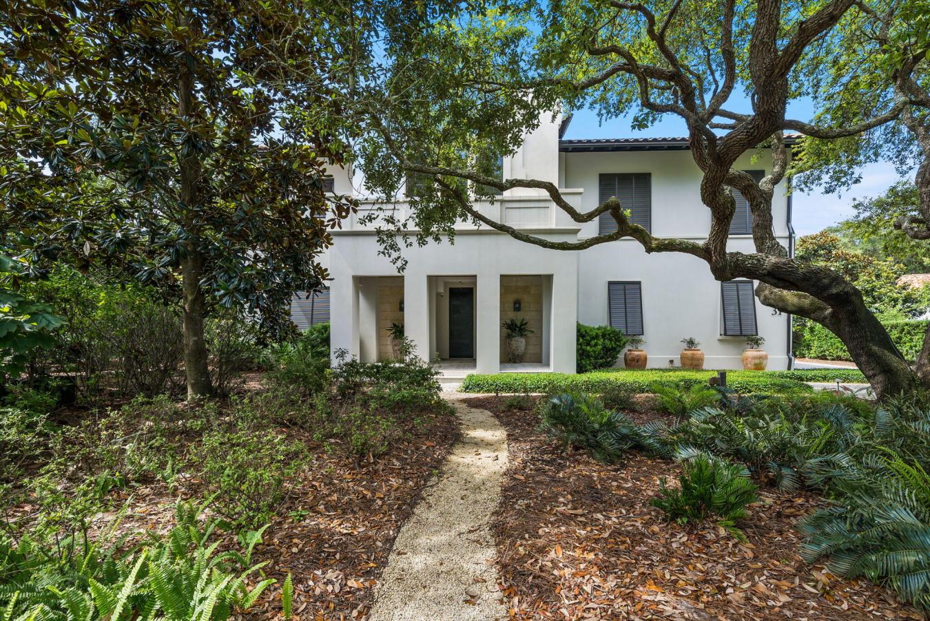 Tucked beneath a canopy of majestic Southern live oaks, this exception – image 2
