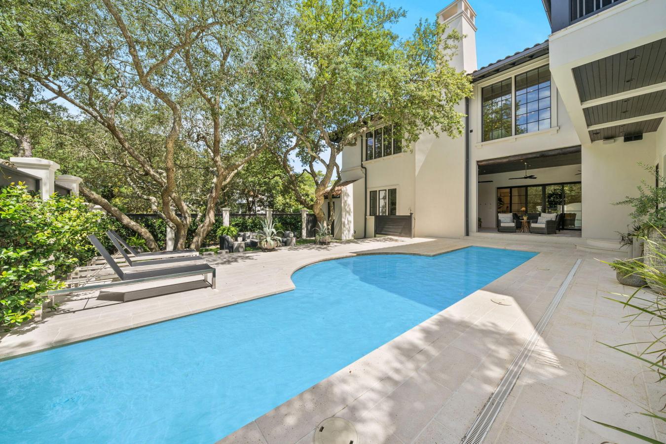Tucked beneath a canopy of majestic Southern live oaks, this exception – image 5