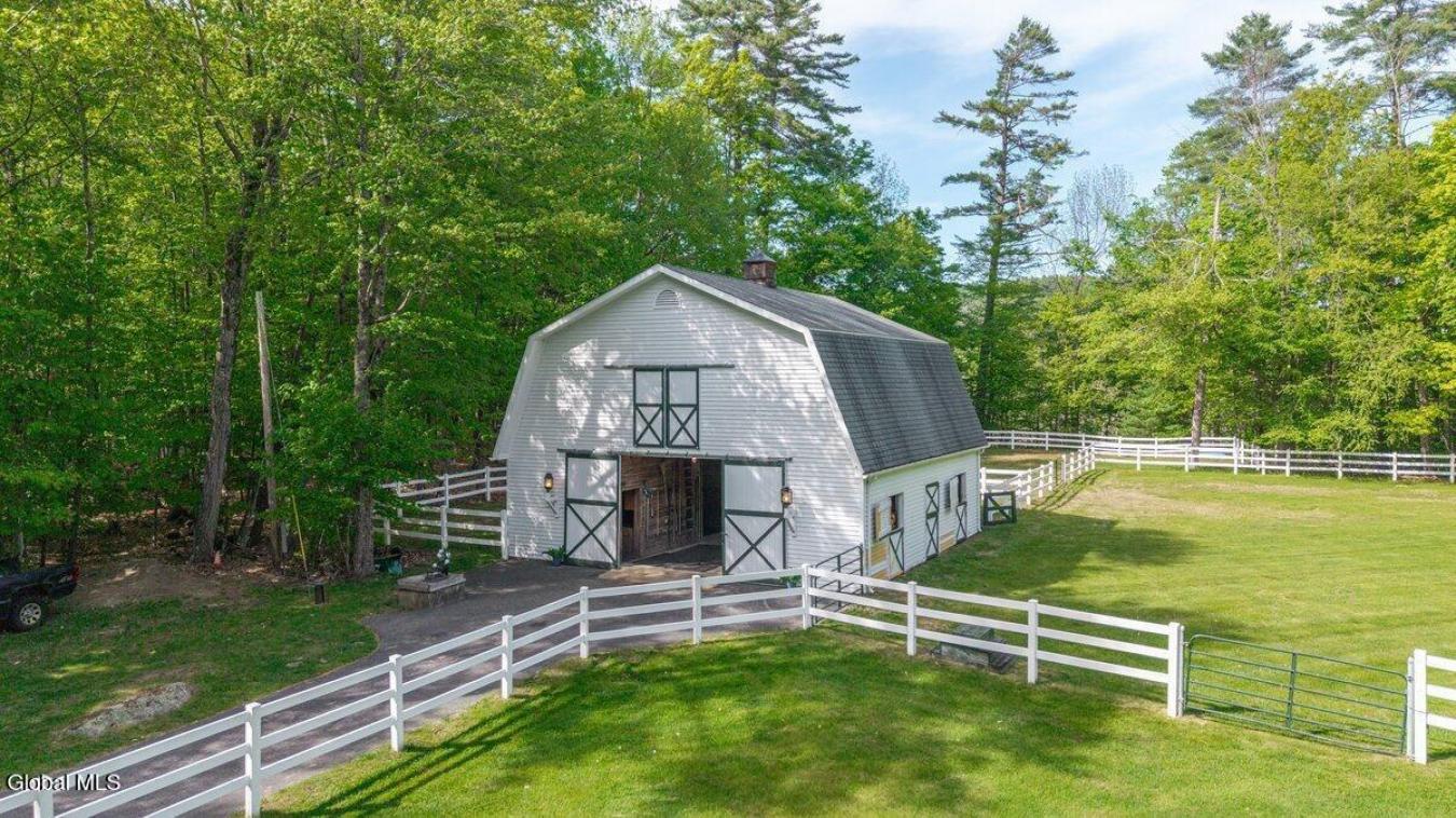 A historic Adirondack legacy, the Island House Estate offers a rare, c – image 14