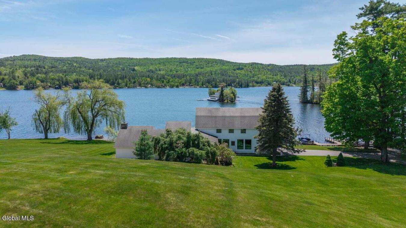 A historic Adirondack legacy, the Island House Estate offers a rare, c – image 16