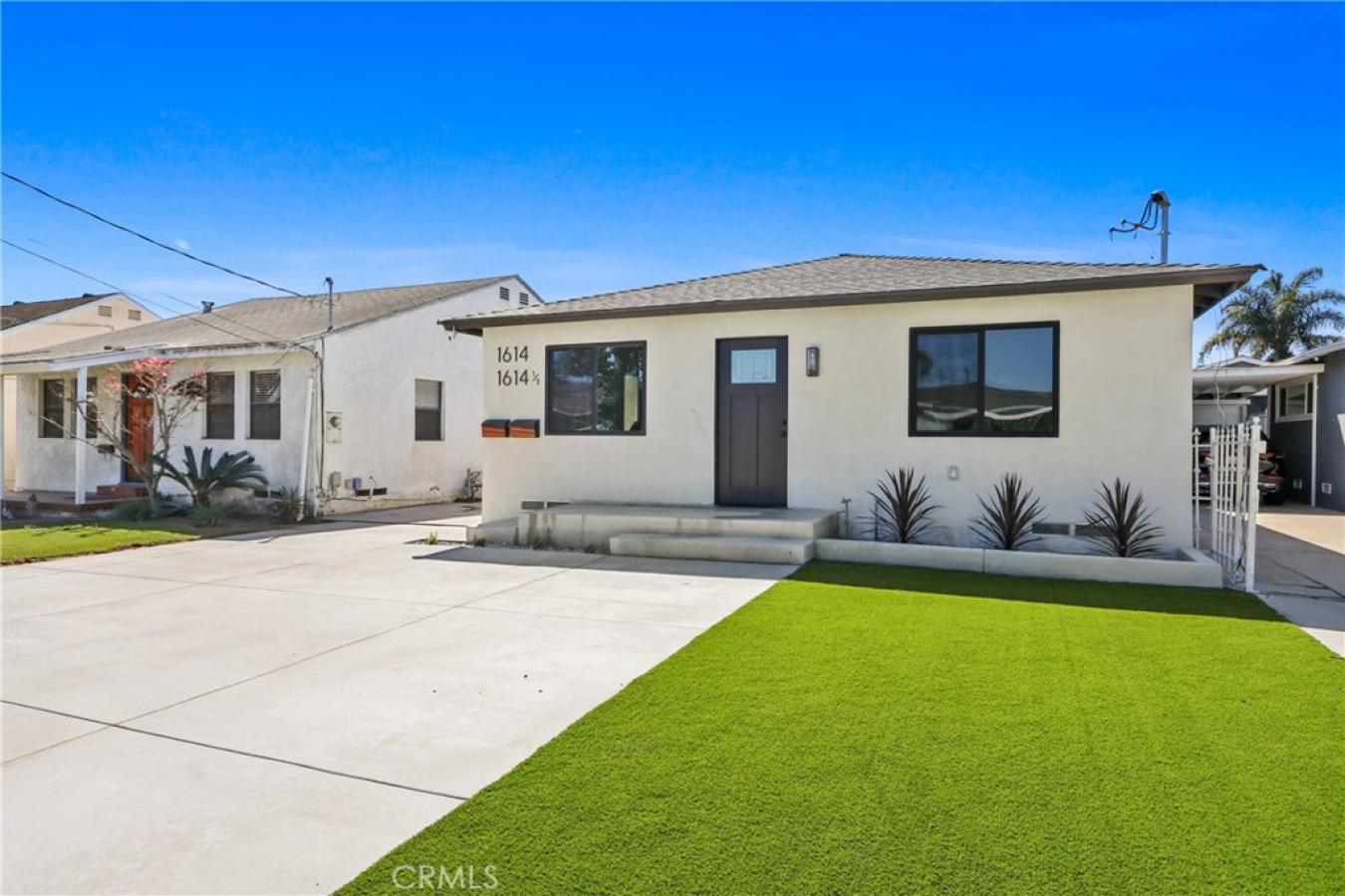 Welcome to 1614 W. 214th Street, a beautifully reimagined four-bedroom – image 1