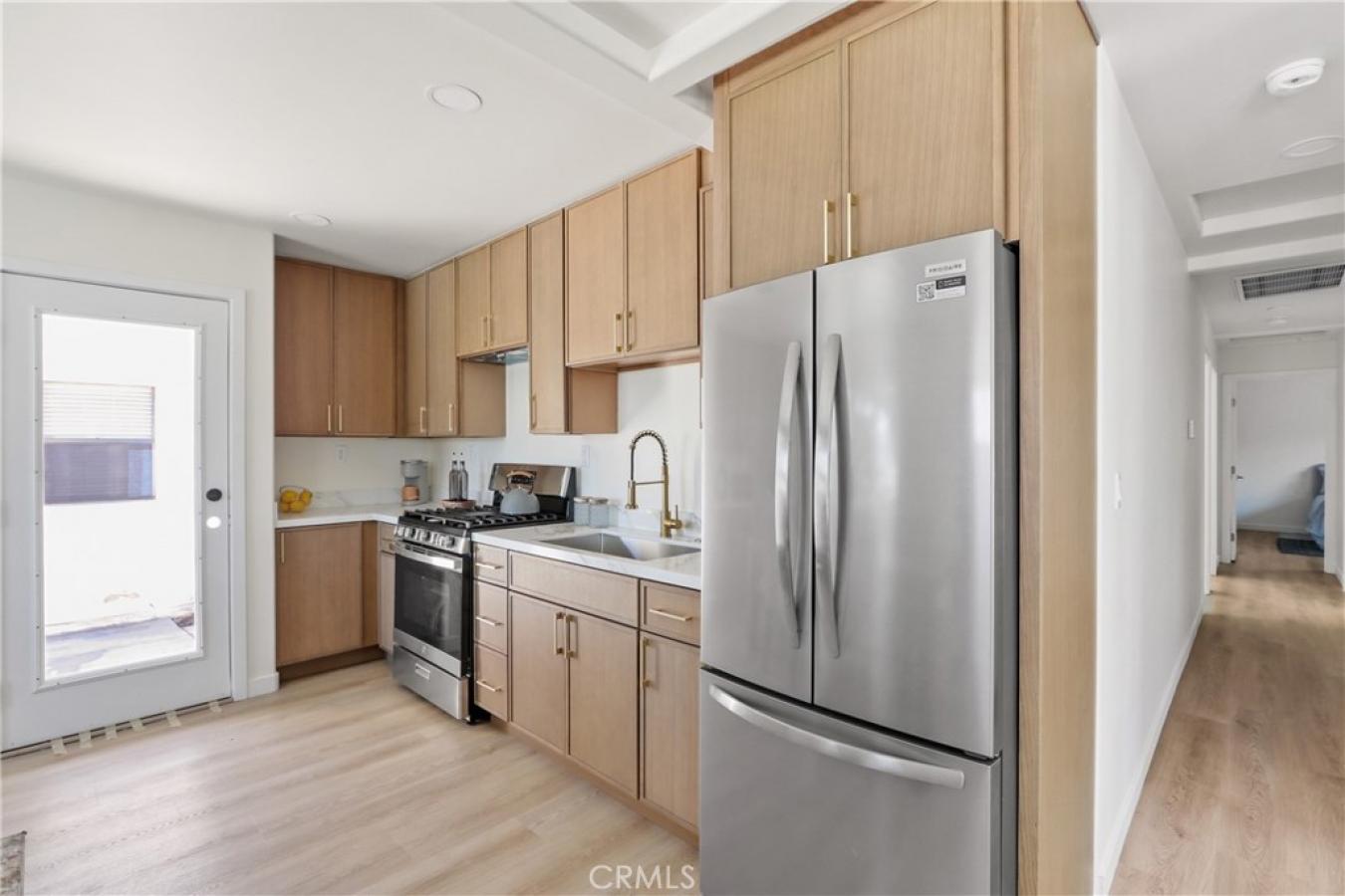 Welcome to 1614 W. 214th Street, a beautifully reimagined four-bedroom – image 9
