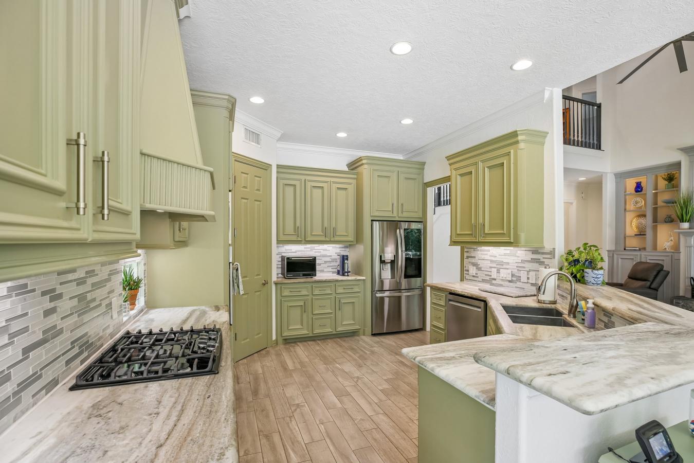 Situated on a secluded, beautifully wooded one-acre estate within the – image 9