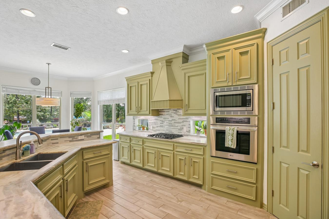 Situated on a secluded, beautifully wooded one-acre estate within the – image 10