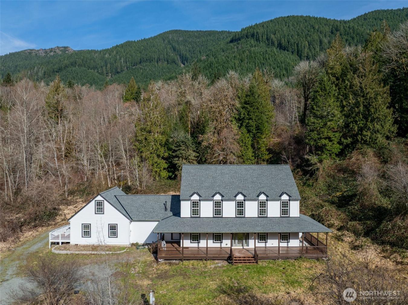 Majestic Colonial-style home on five secluded acres, an updated countr – image 1