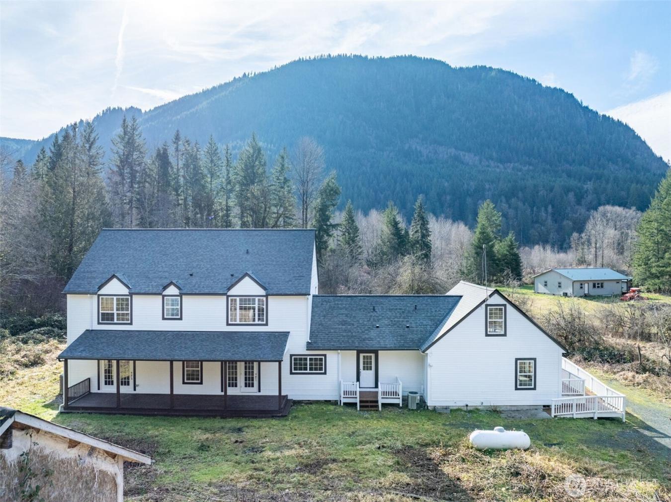 Majestic Colonial-style home on five secluded acres, an updated countr – image 2
