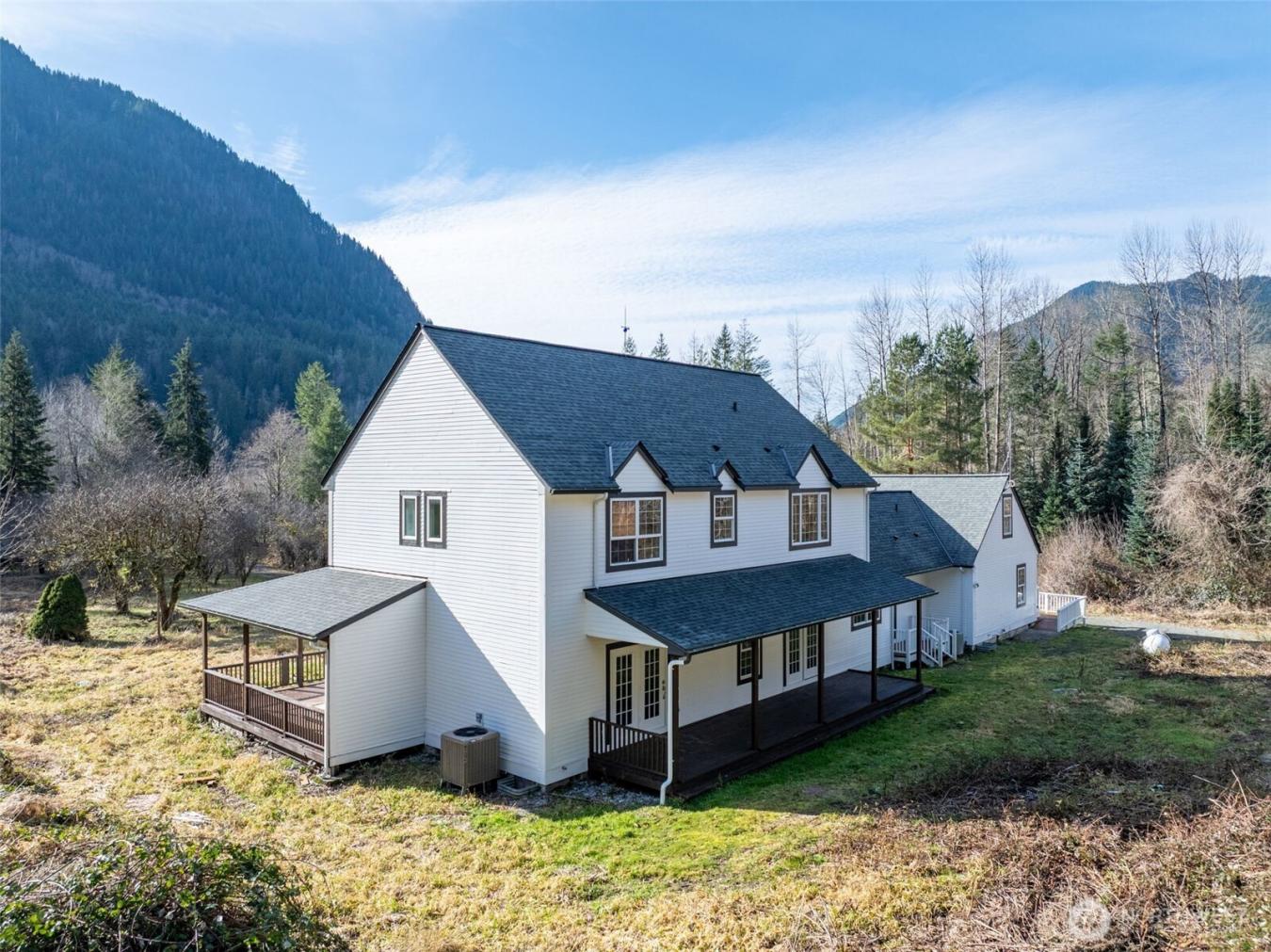 Majestic Colonial-style home on five secluded acres, an updated countr – image 3
