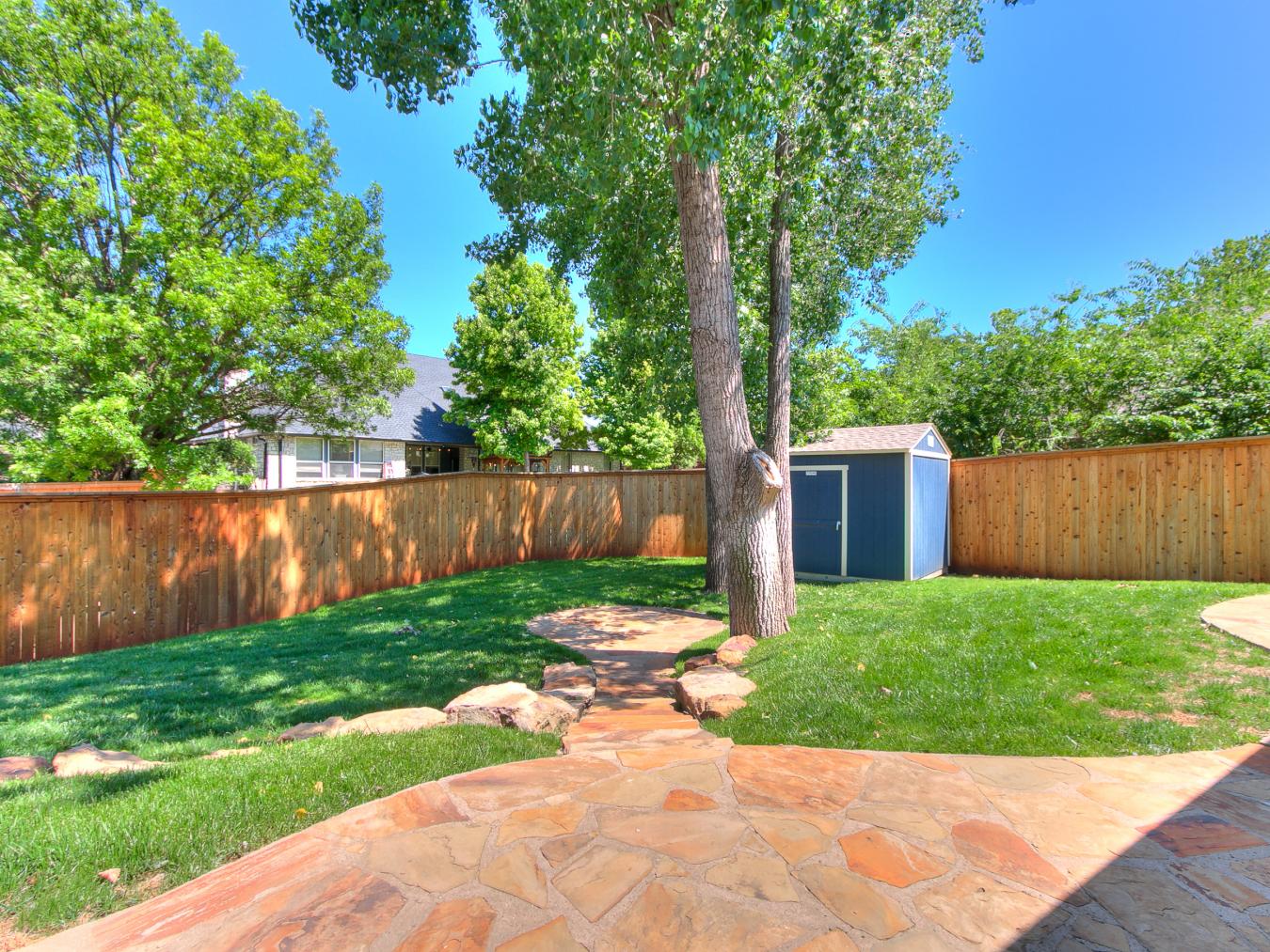 Nestled in the sought-after Blue Stem Lake Addition, this stunning cus – image 8