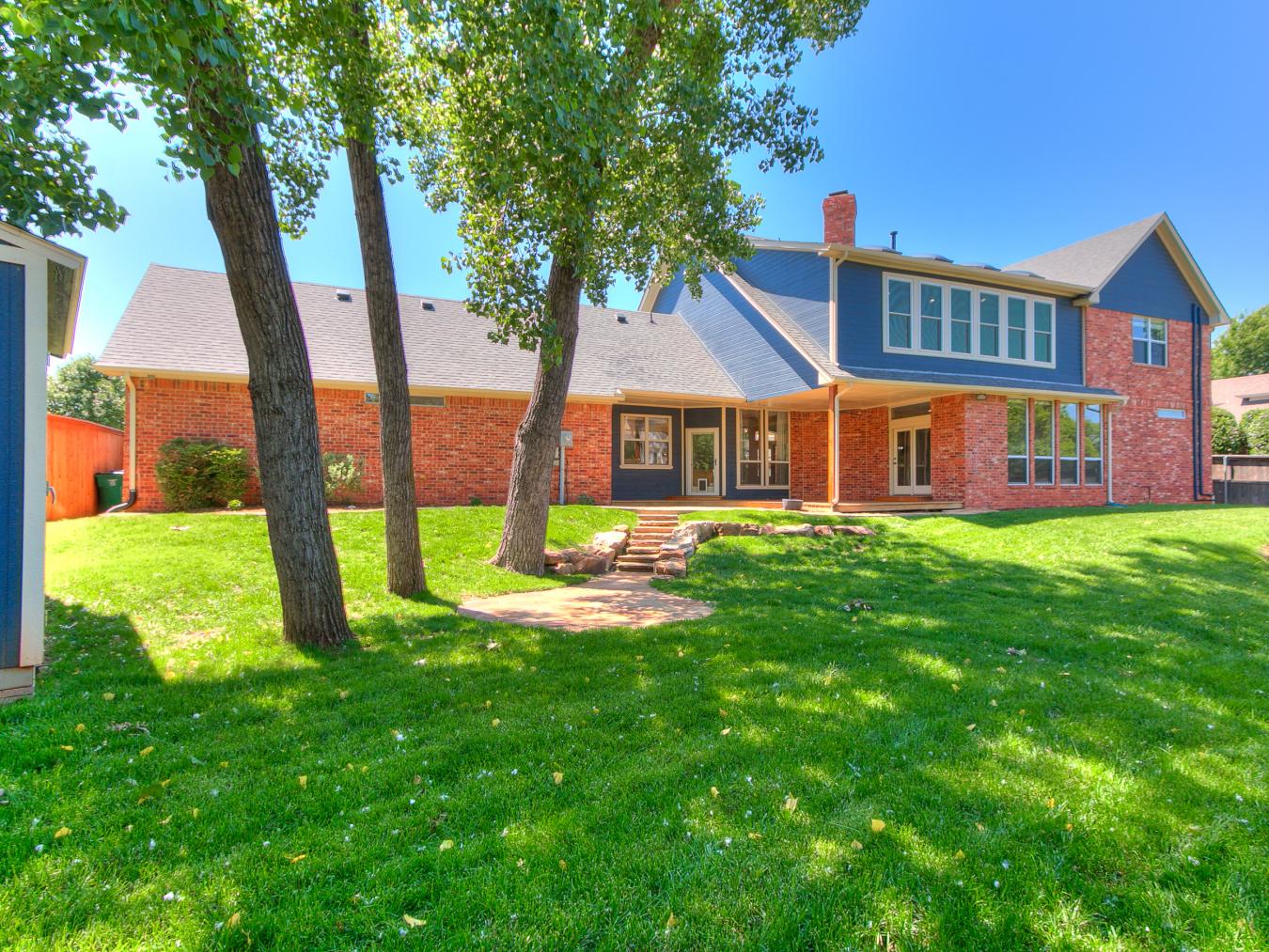 Nestled in the sought-after Blue Stem Lake Addition, this stunning cus – image 10