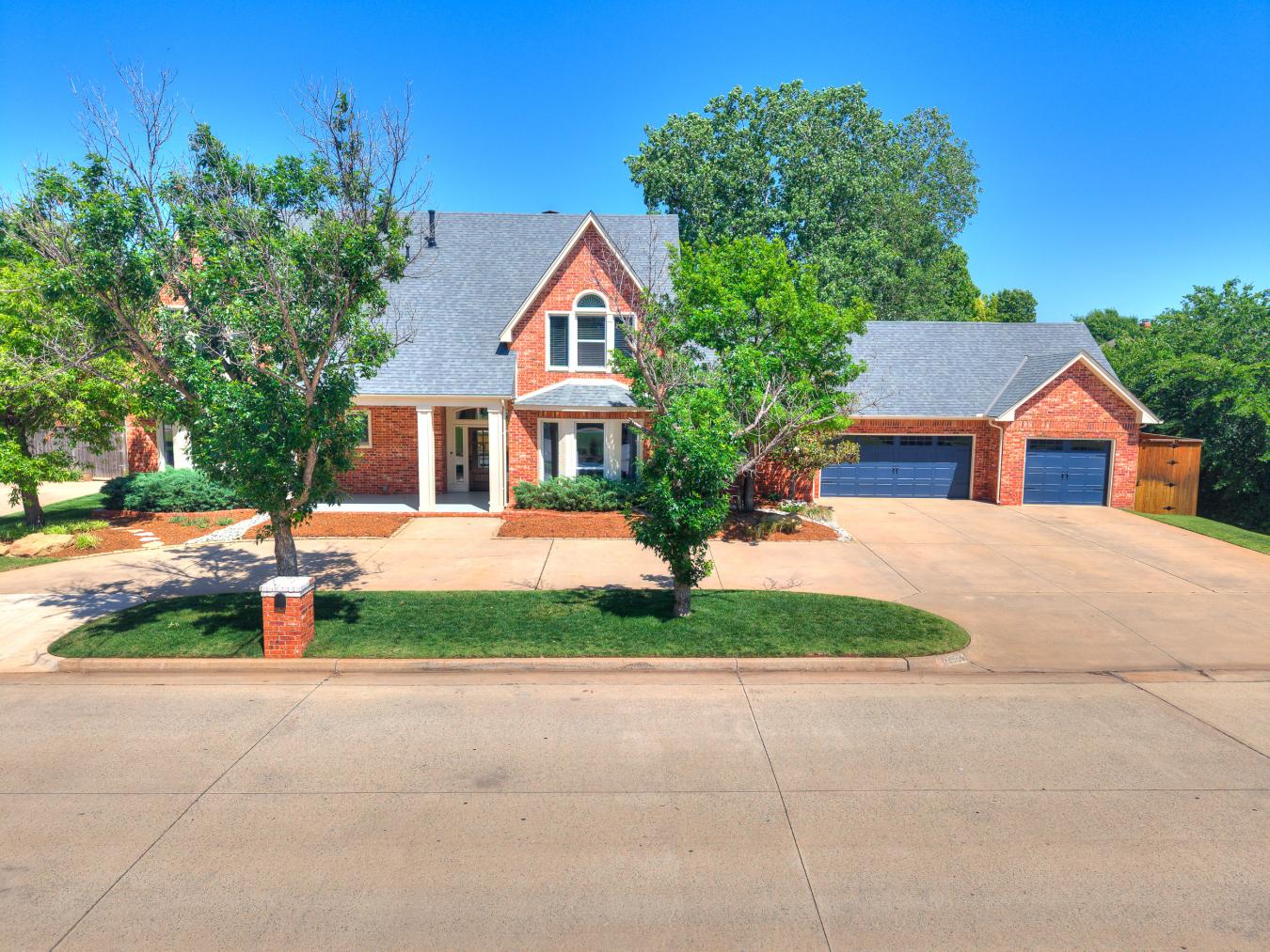Nestled in the sought-after Blue Stem Lake Addition, this stunning cus – image 11