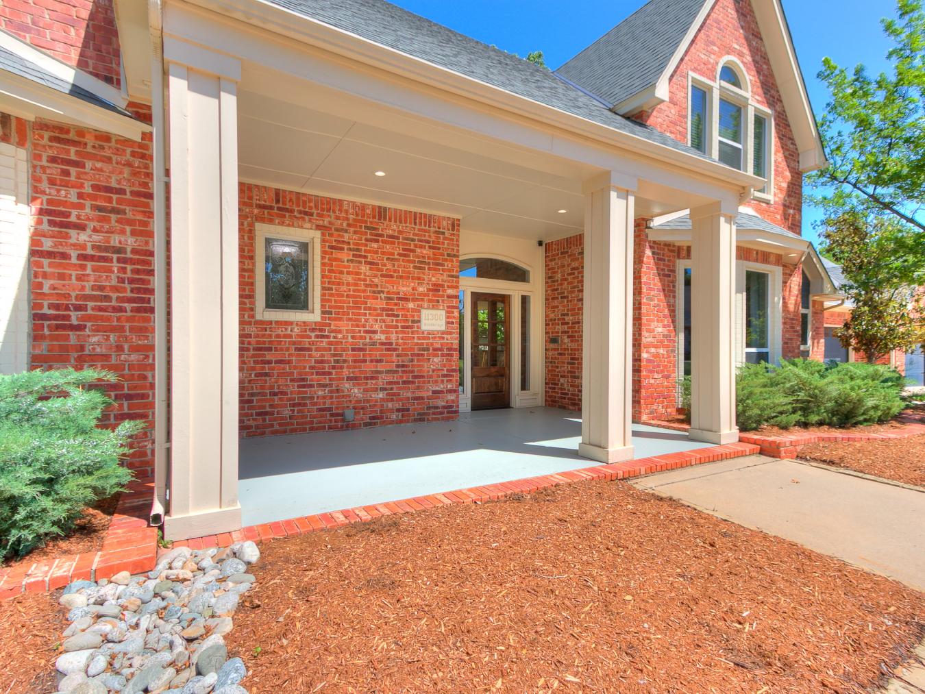 Nestled in the sought-after Blue Stem Lake Addition, this stunning cus – image 2